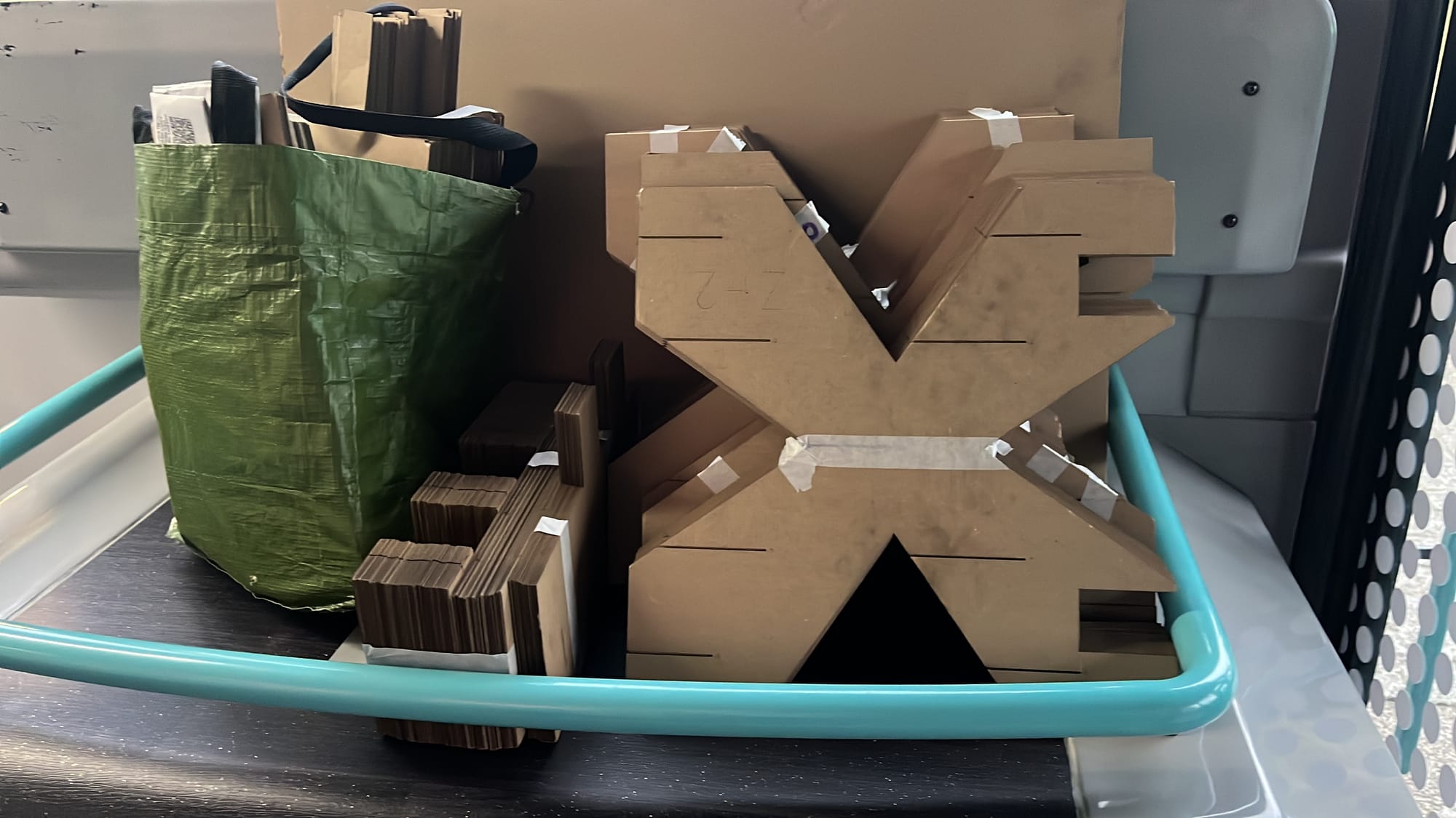 Photograph of more cardboard pieces in transit.