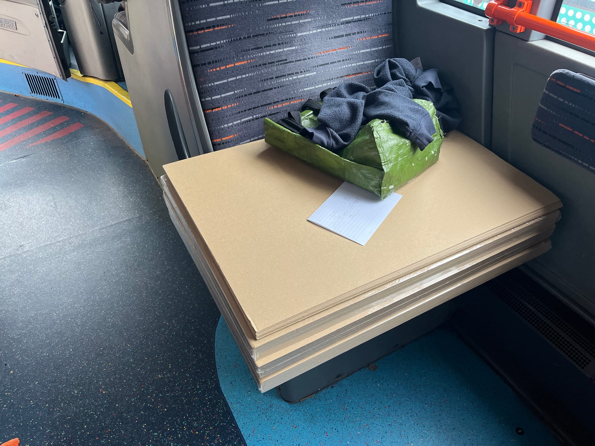 Photograph of cardboard stack on way to manufacturing lab.