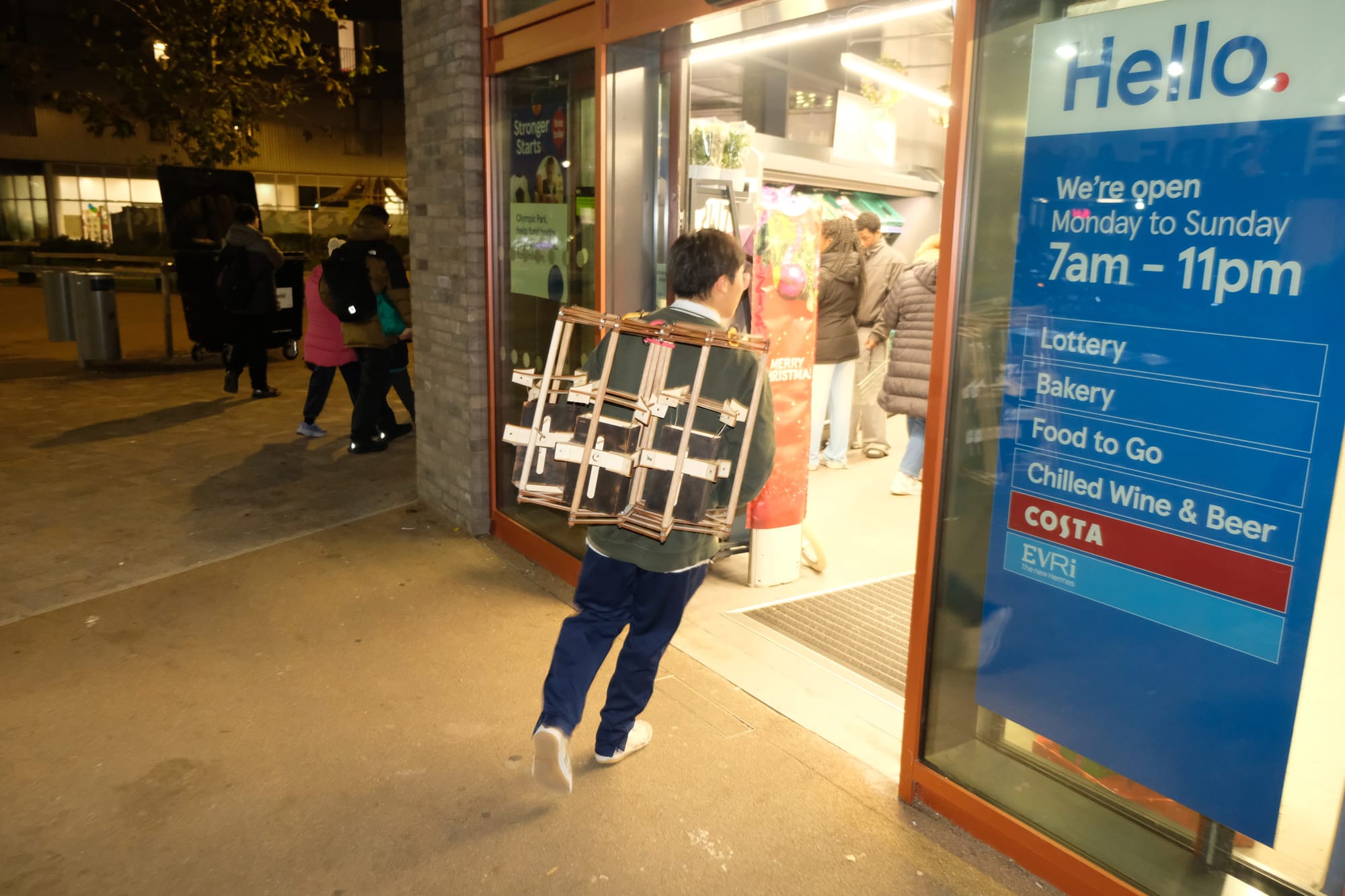 Rex visiting shops with the backpack in the first outdoor test.